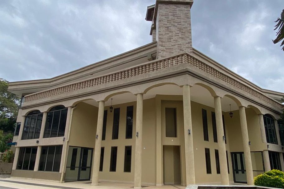 Villa exterior with columns and a covered entrance
